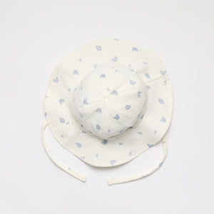 Baby sun hat with enchanted garden print in blue 