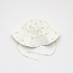 Baby sun hat with enchanted garden print in blue 