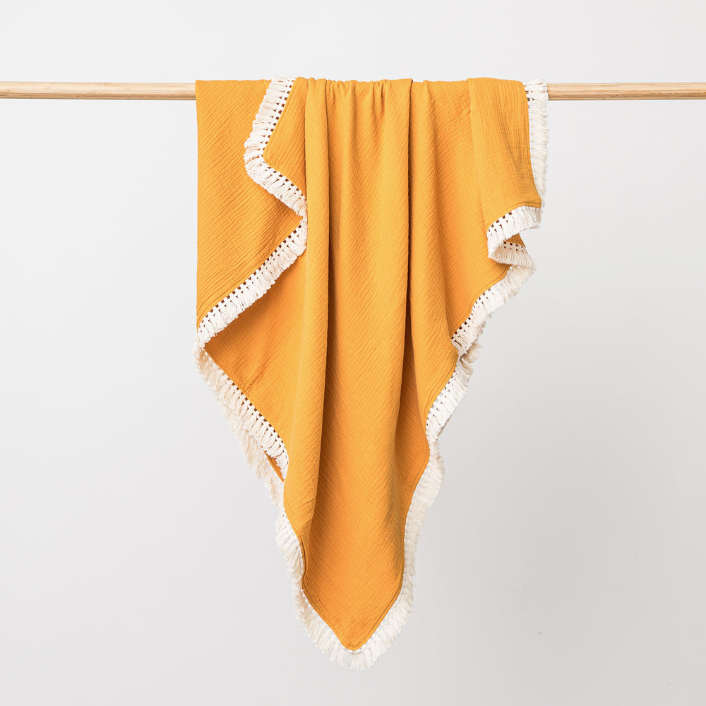 Organic cotton muslin baby blanket with lace trim in saffron