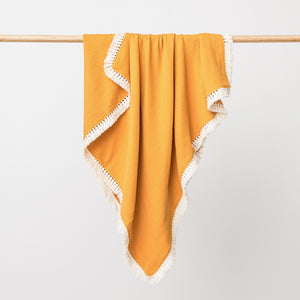 Organic cotton muslin baby blanket with lace trim in saffron